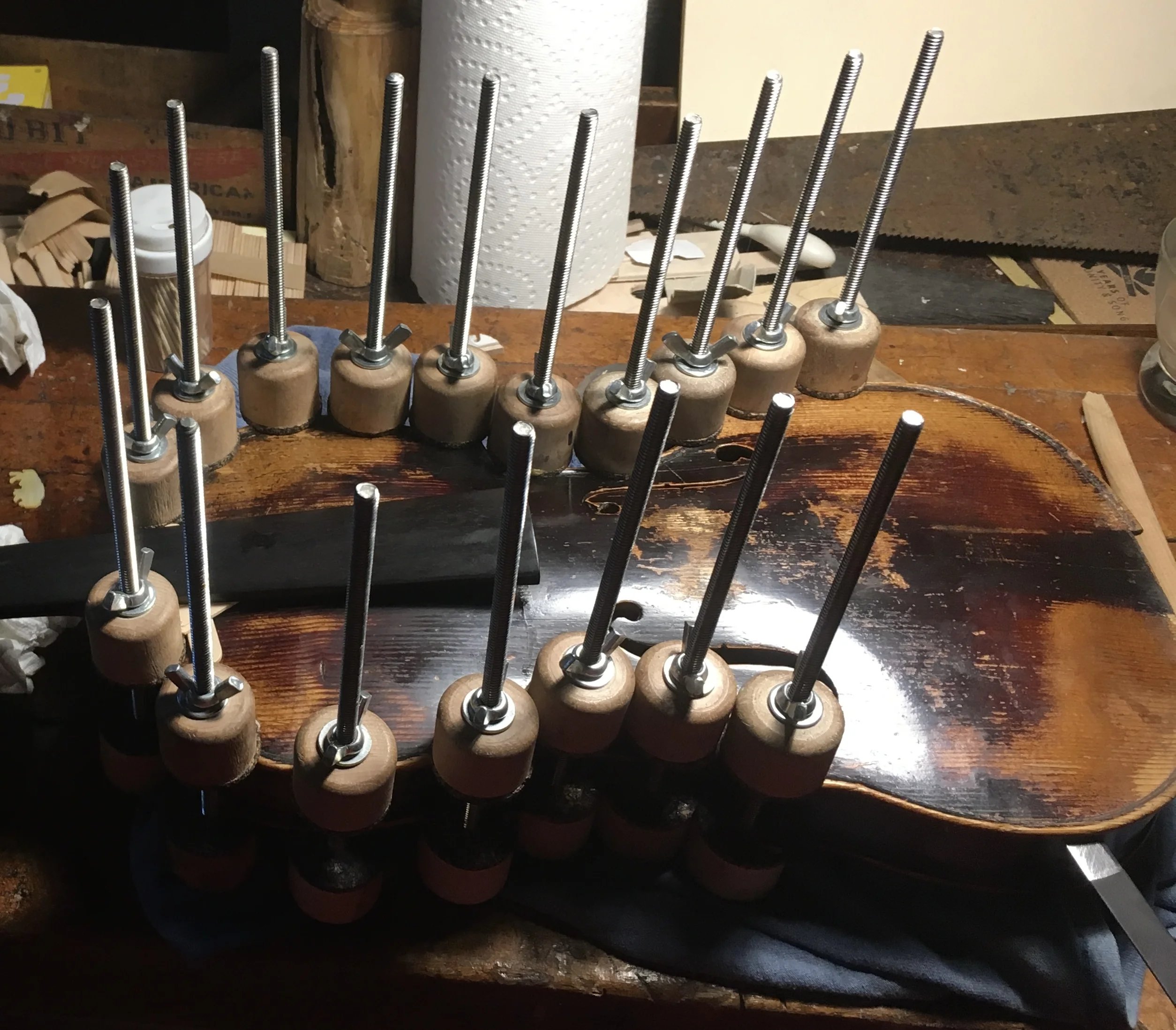 Professional clamping system for mandolin repair