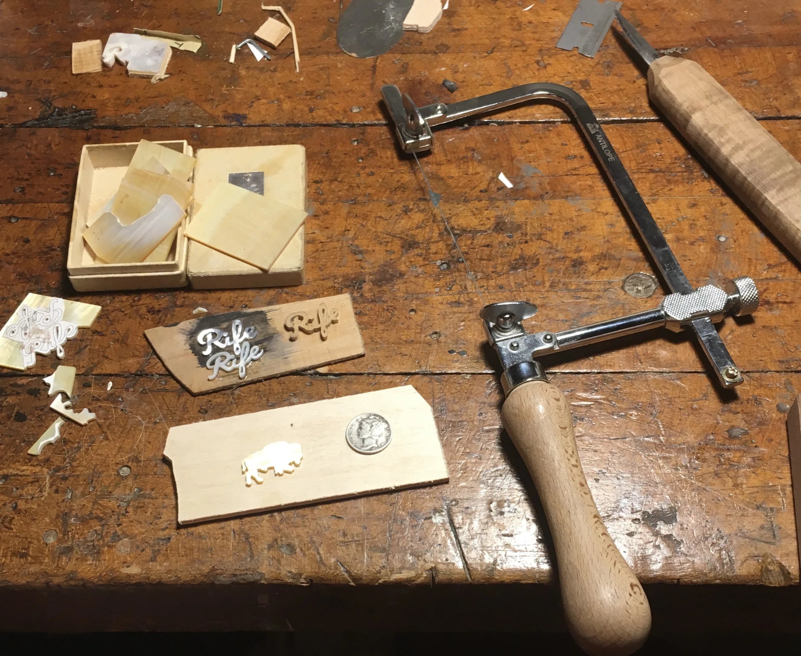 Hand-cutting mother-of-pearl pieces for headstock inlay with precision tools
